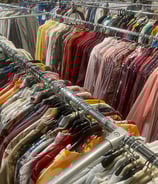 a rack of clothes and clothes hanging on a rack