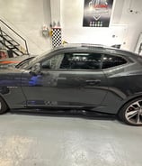 a car in a garage with a checkered window