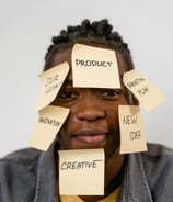 a man with sticky notes on his face