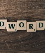 a wooden block with words adwordss on it