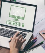 a laptop with a website designers logo on