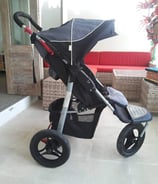 a baby stroller with a baby in a stroller