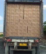 a truck with a large wicker on the back of it