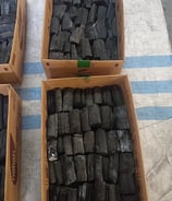 a table with three boxes of charcoal charcoal charcoal charcoal charcoal charcoal charcoal charcoal charcoal charcoal