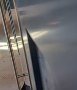 shows the precise alignment of an ice machine front door panel and a cabinet door panel