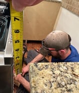 shows install of an electric range by our installer in progress