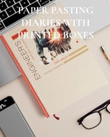 a laptop and a notebook with a notebook and a pen and a notebook with a