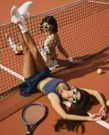 Two models in coordinated tennis looks, Bali fashion campaign photography.