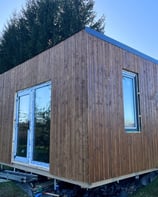 Wooden decor arround a wooden house.