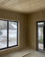 Wooden decor in a house with windows.