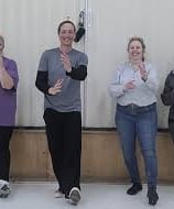 Johnny and participants practicing the principle of Body Upright with Rubber Duckies on their heads.