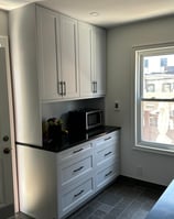 a kitchen with a microwave, microwave, and a microwave