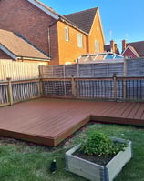 Garden decking with fence behind