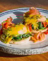 a plate of food with eggs and cheese on it