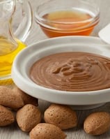 a bowl with nuts and almonds