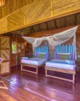 twin beds in wooden bungalow retreat center