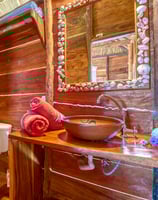 bathroom in wooden bungalow retreat center central america