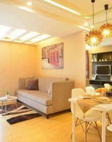 a living room with a couch and a television
