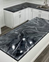 Epoxy countertops in Lincoln home- Dirty pour with grey, white, carbon black pigments