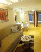a living room with a couch and a television