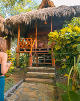 wooden bungalow in tropical garden