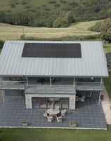 a house with solar panels on the roof 