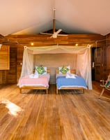 twin beds in wooden bungalow retreat center