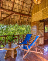 terrace on wooden bungalow in the middle of the garden