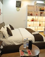 Premium Room at Hotel Kuber Murthal offering stylish interiors and cozy ambiance.