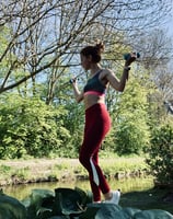 a woman in a sports bra top and leggings