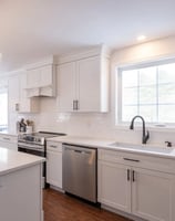 a kitchen with a large island and a large window