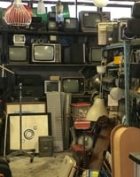 a room with a lot of different types of televisions, electronics, e-waste, ewaste