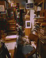 a room with a lot of books and a desk. Clutter, hoarding, hoarder, junk
