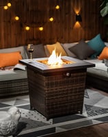 a patio table with a glass of wine and a glass of wine