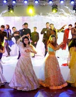 guests are enjoying group performance in a wedding ceremony