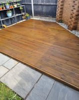 a wooden deck with a wooden decking area