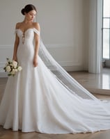 A rack filled with white bridal dresses, hanging neatly in a wooden-furnished room. There is a floor-to-ceiling mirror on the right side reflecting the dresses and part of the golden rod the gowns hang on.