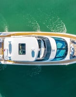 a boat with a large white boat in the water