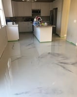 Epoxy Marbel floor in Grand Island home- white and grey pigments