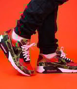Nike Air Max 90 SP 'Reverse Duck Camo' (2020) sneaker in brown camo print with orange accents and retro trail-inspired design