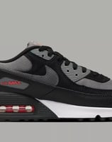 Nike Air Max 90 sneakers in Black, Pewter Gray, and University Red colorway with visible Air cushioning