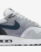 Nike Air Max 1 'London' sneaker in Urban Grey with Sail midsole, gum outsole, and deconstructed Swoosh design