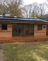 garden room with solar panels and skylights