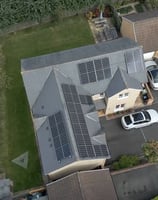 a house with solar panels installed on a roof