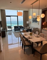 a dining room table with a table and chairs