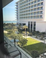 a balcony with a view of a large building