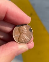 a person holding a penny penny penny penny penny penny penny penny penny penny penny penny