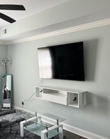 Basic TV install with decorative floating shelf underneath