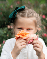 a little girl with a flower in her hair