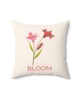 a pillow with a flower blooming on it